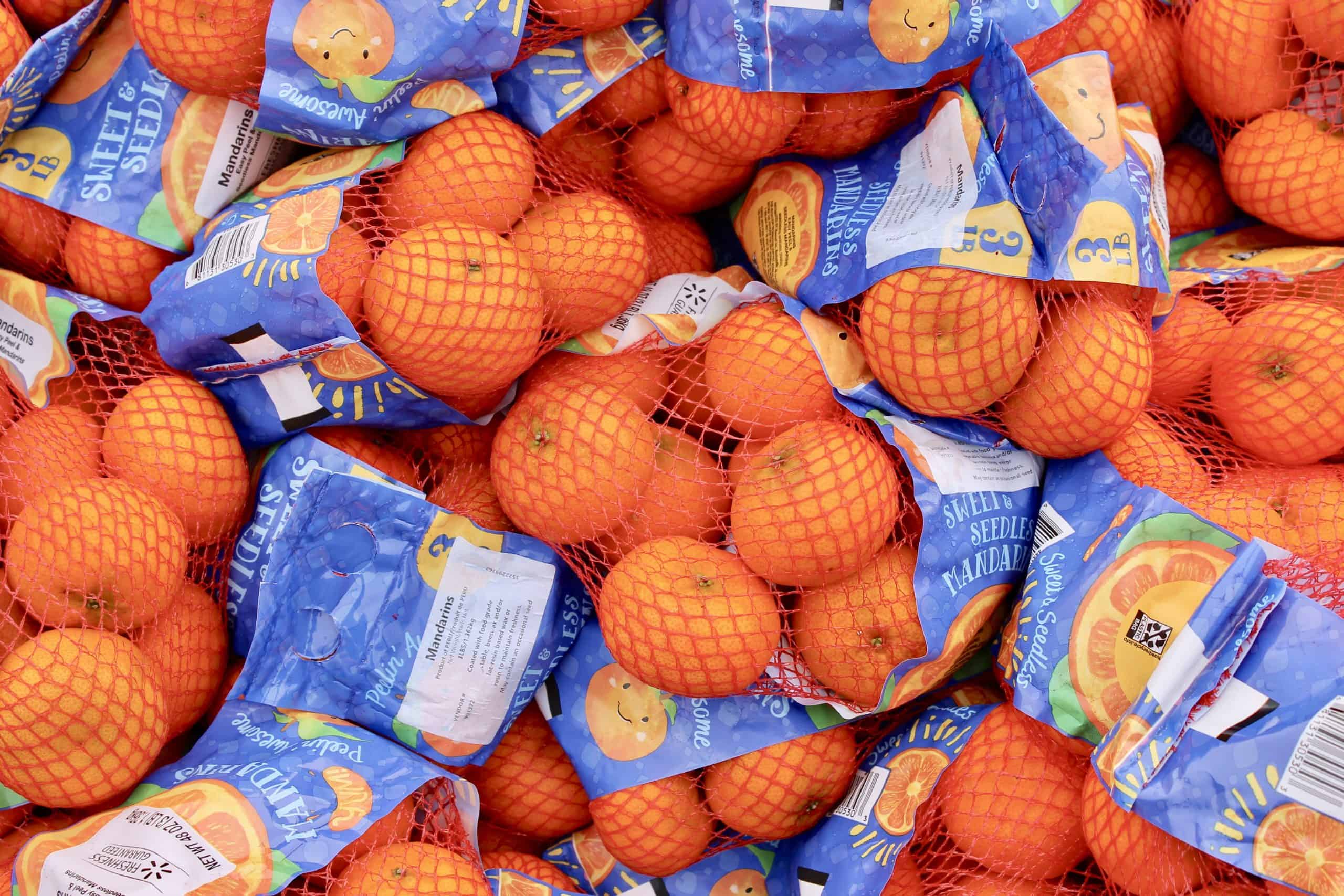 Pile of bagged oranges. Orange.Picture taken at Plaza Mariachi Mobil Pantry in Nashville (Davidson County) on August 15, 2020. MP was hosted by One Gen Away.